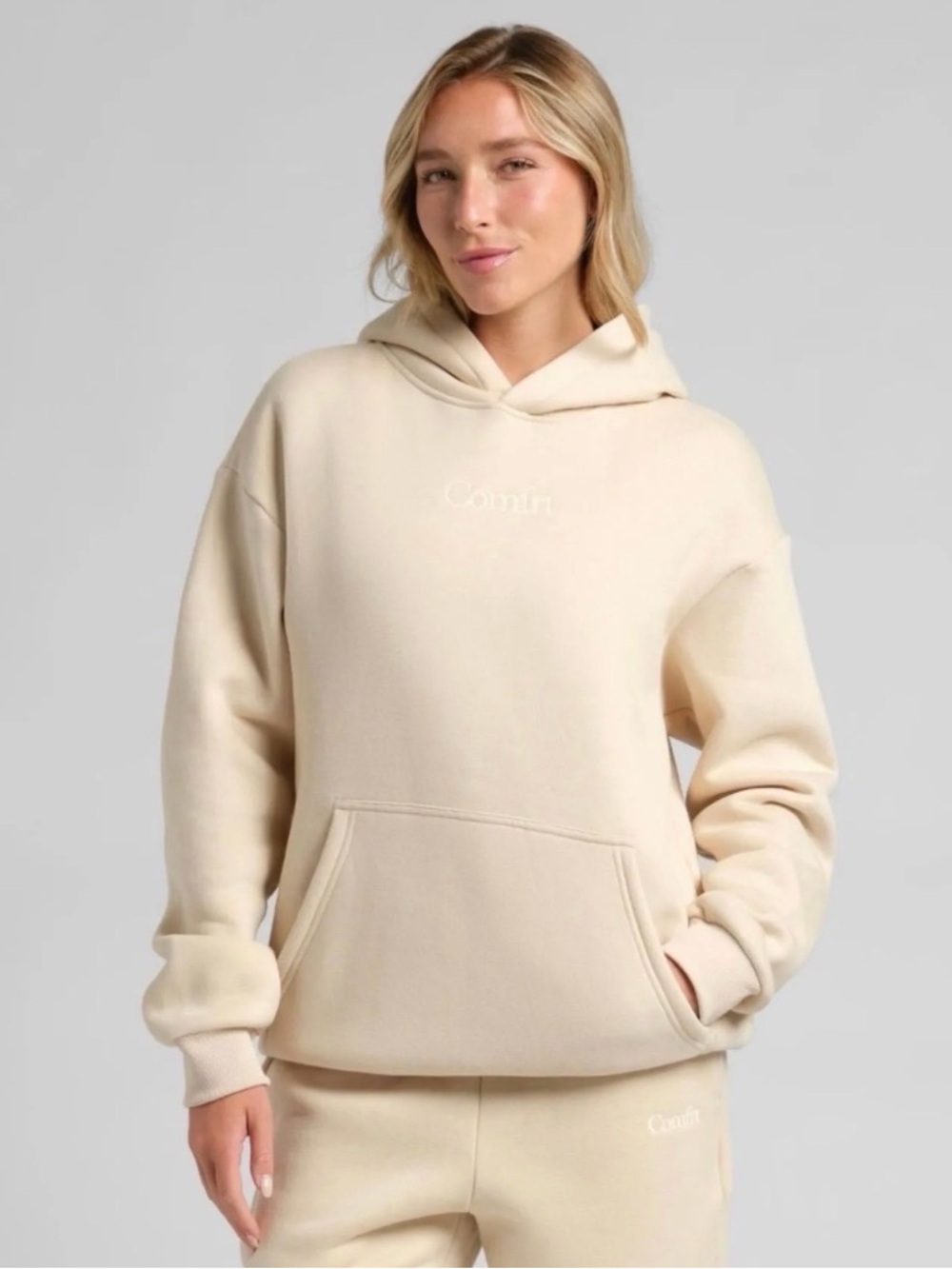 Comfort-Fit Cream Hoodie with Subtle Logo